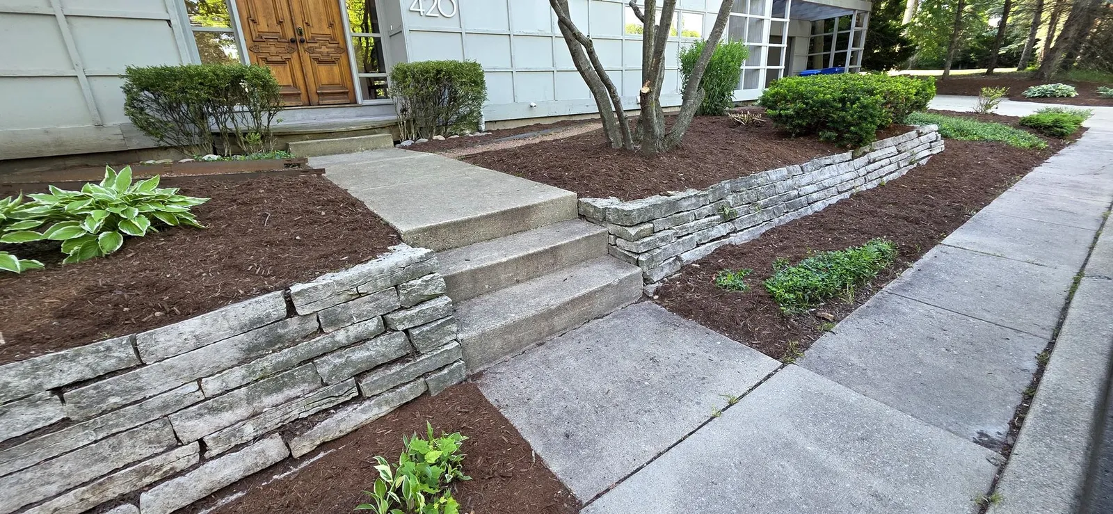 Front-entry flagstone walls and renovated beds